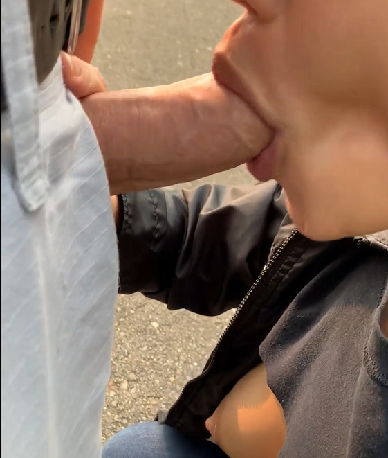 Woman gives a blowjob in public