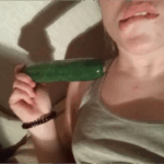 college girl using cucumber as dildo