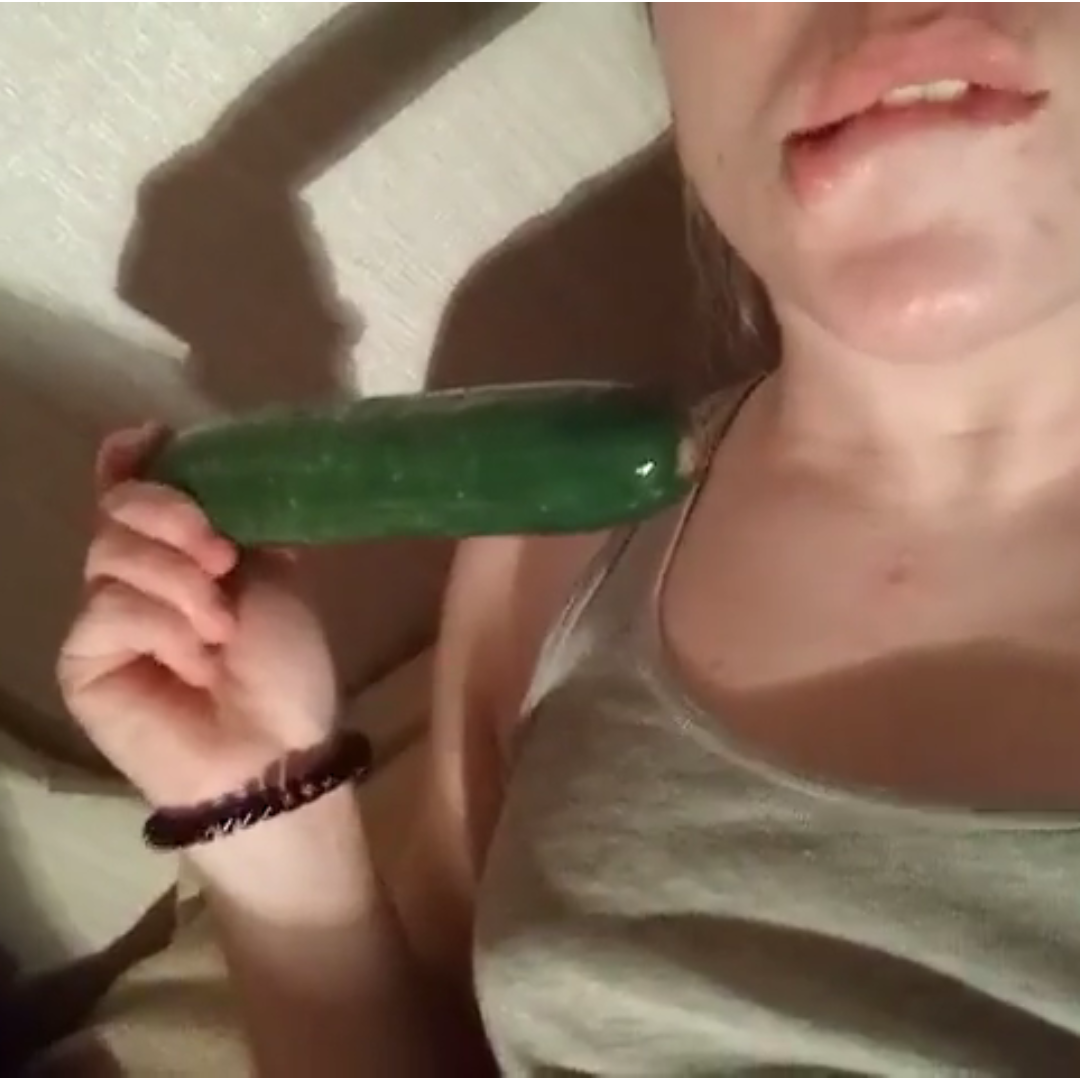 college girl using cucumber as dildo