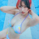 eeelyeee wearing swimsuit by the pool with armpits showing