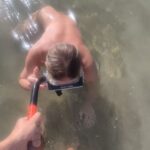 couple skinny dipping at the beach